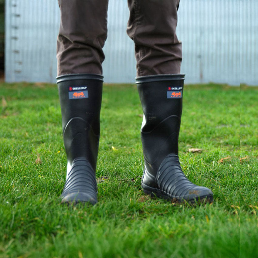 Skellerup 4x4 wellies in a field